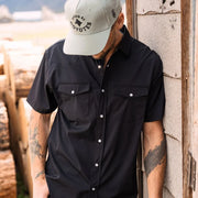 Go Everywhere Solid Pearl Snap Short Sleeve Shirt by Raised By Coyotes
