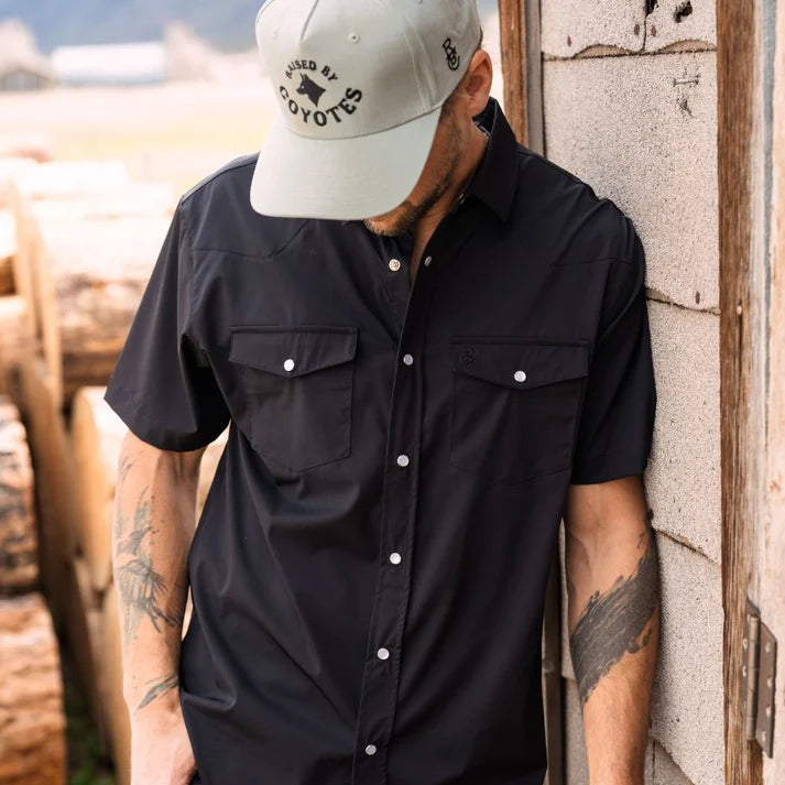 Go Everywhere Solid Pearl Snap Short Sleeve Shirt by Raised By Coyotes