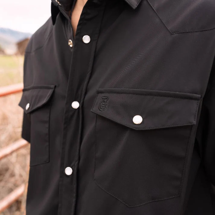 Go Everywhere Solid Pearl Snap Short Sleeve Shirt by Raised By Coyotes