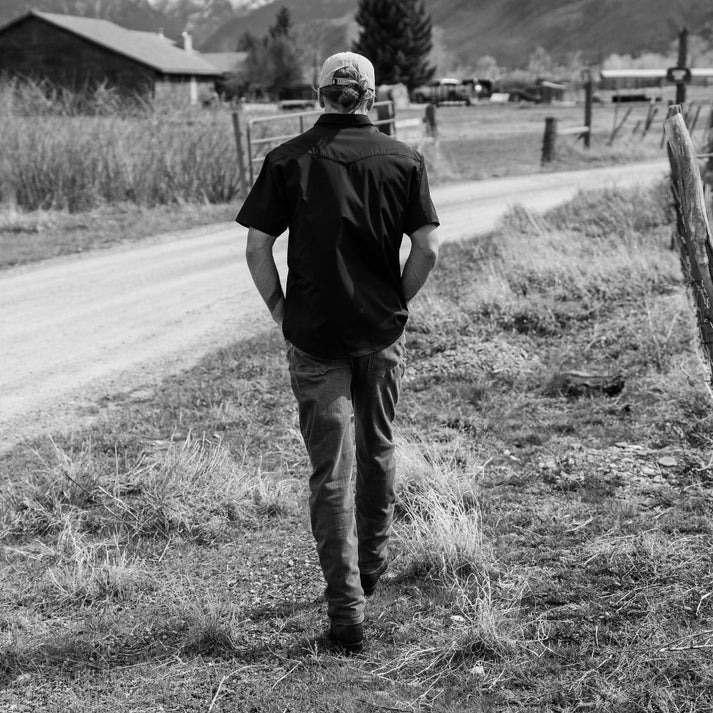Go Everywhere Solid Pearl Snap Short Sleeve Shirt by Raised By Coyotes